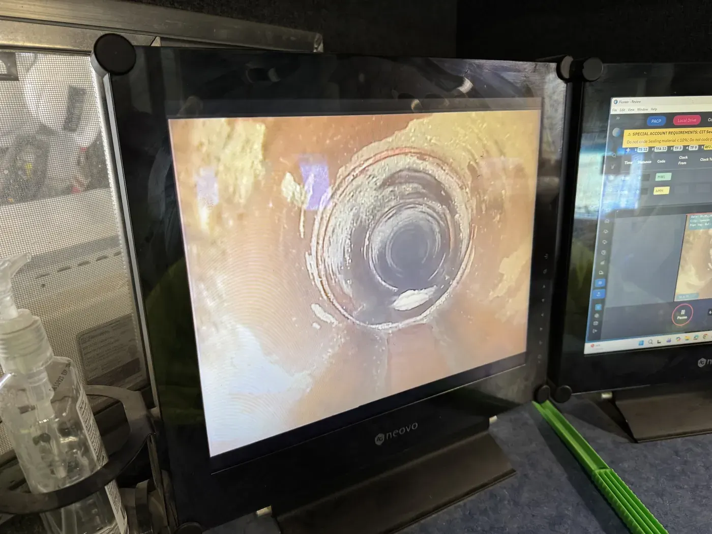 Inspection video of a pipe interior displayed on the monitor inside a CIT televising truck.