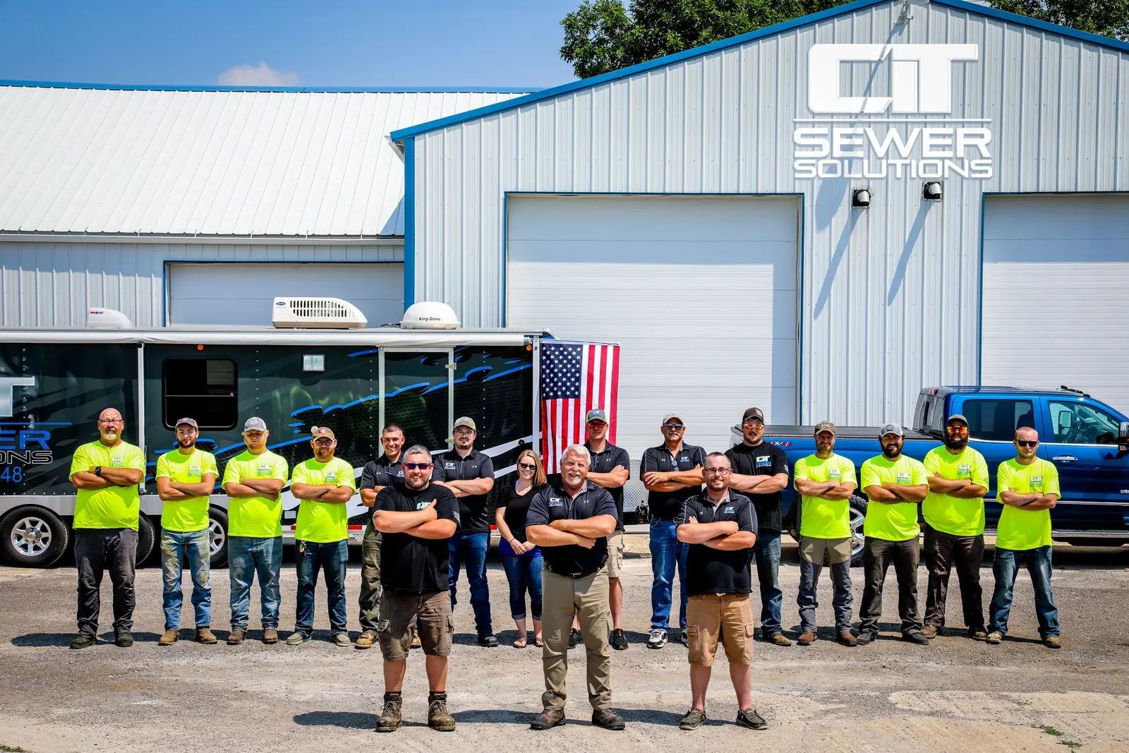 The CIT Sewer Solutions team gathered outside the company building.