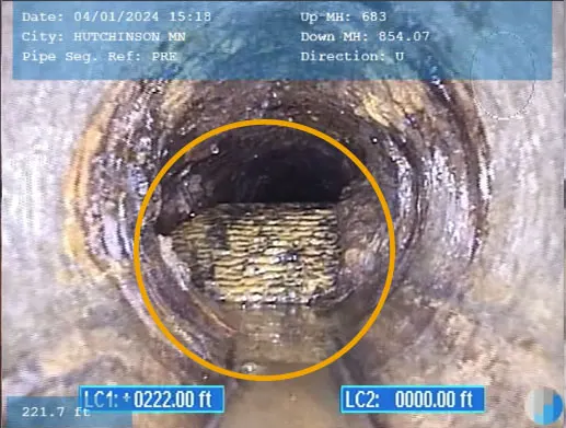Original CIT-published camera capture of a wide textured obstruction, with its inspection overlays and circular annotation.