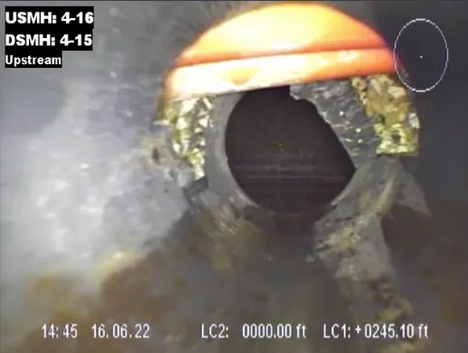Original CIT-published camera capture of an orange utility near a lateral opening, with its recorded inspection overlays.