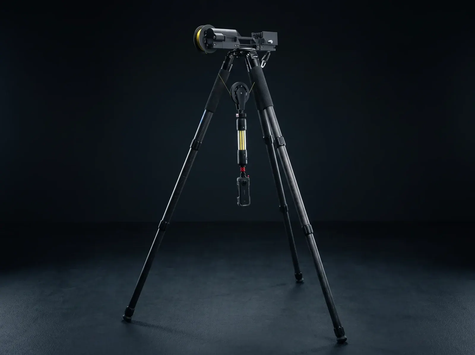 Tripod-mounted lowering unit with a suspended manhole inspection camera and lighting.